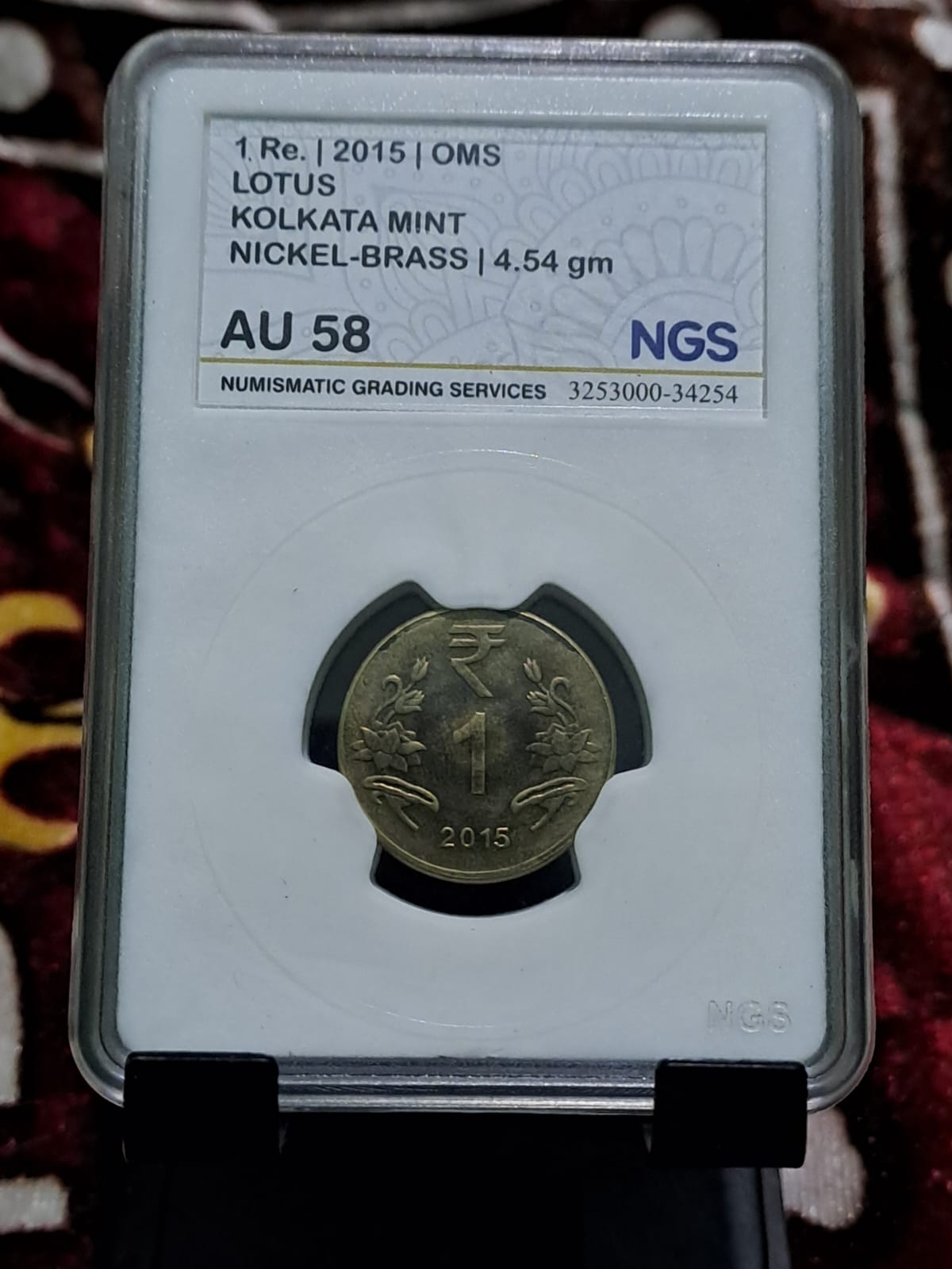 One rupees oms coins graded